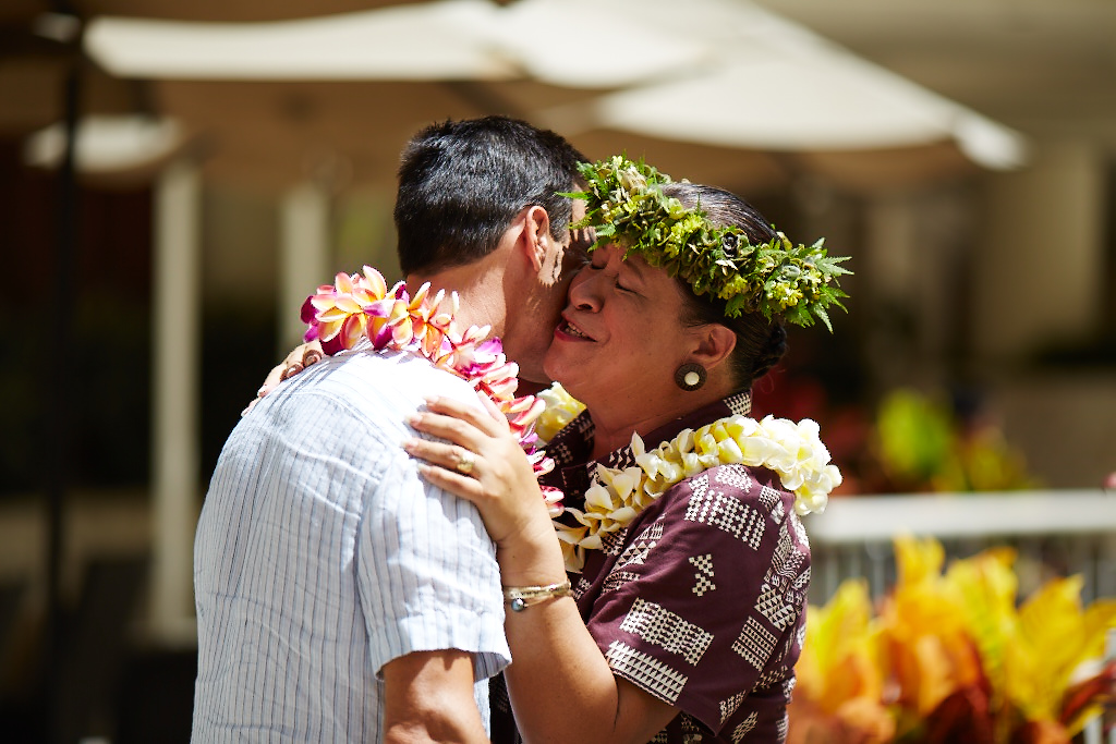 Aunty Luana giving a lei to a guest