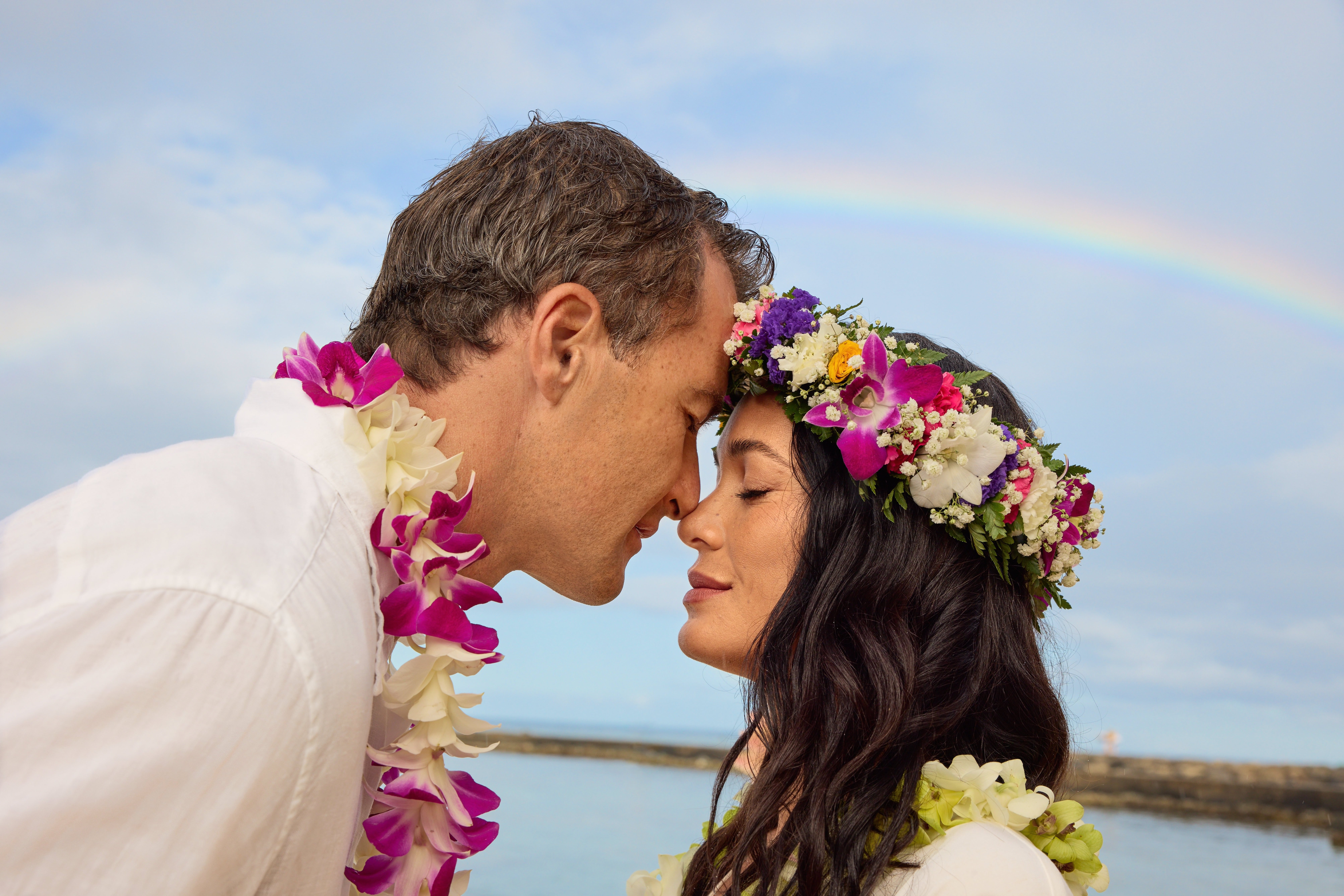 Couple doing a vow renewal ceremony on the beach