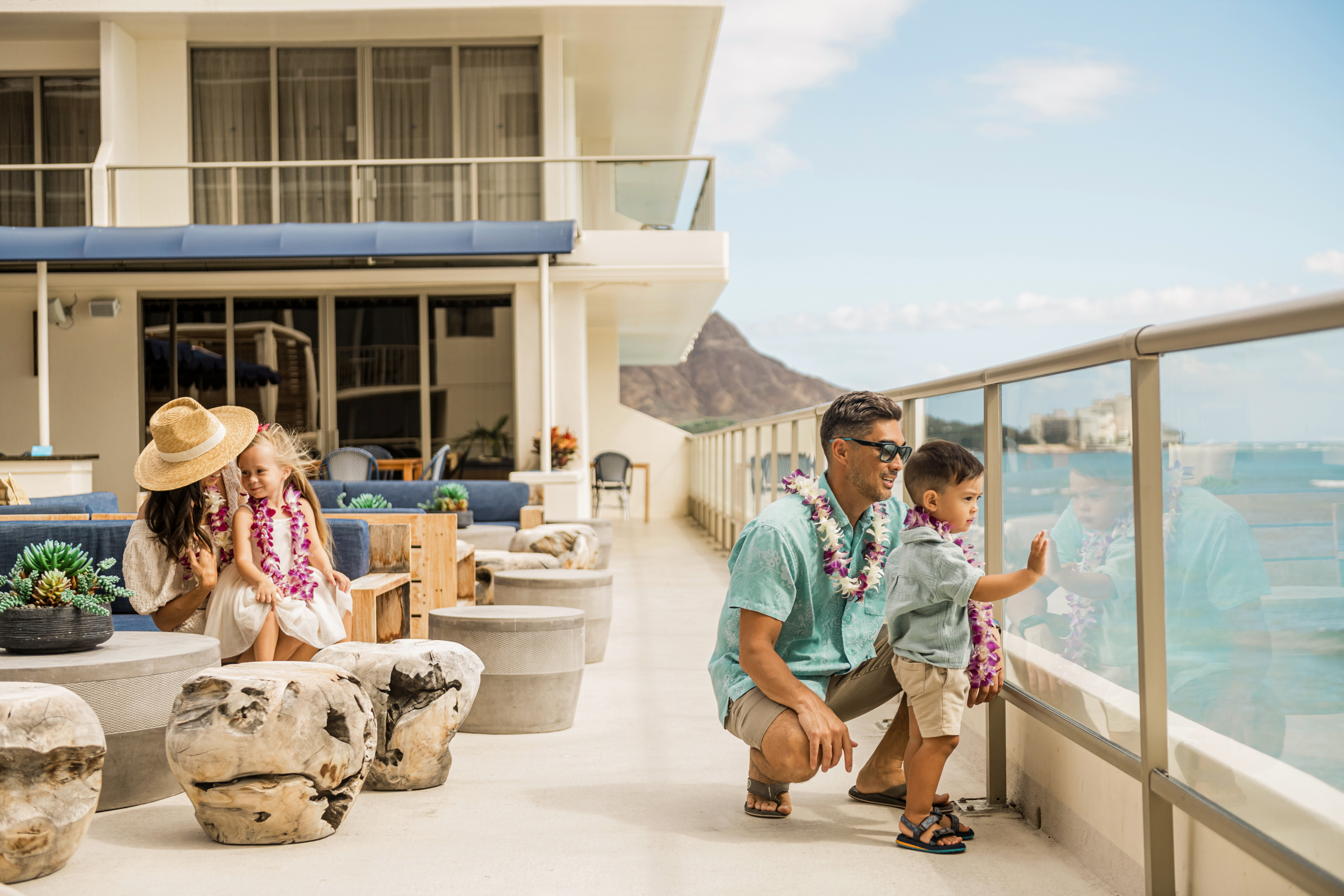 Family enjoying the view at the Voyager 47 Club Lounge at OUTRIGGER Reef Waikiki Beach Resort