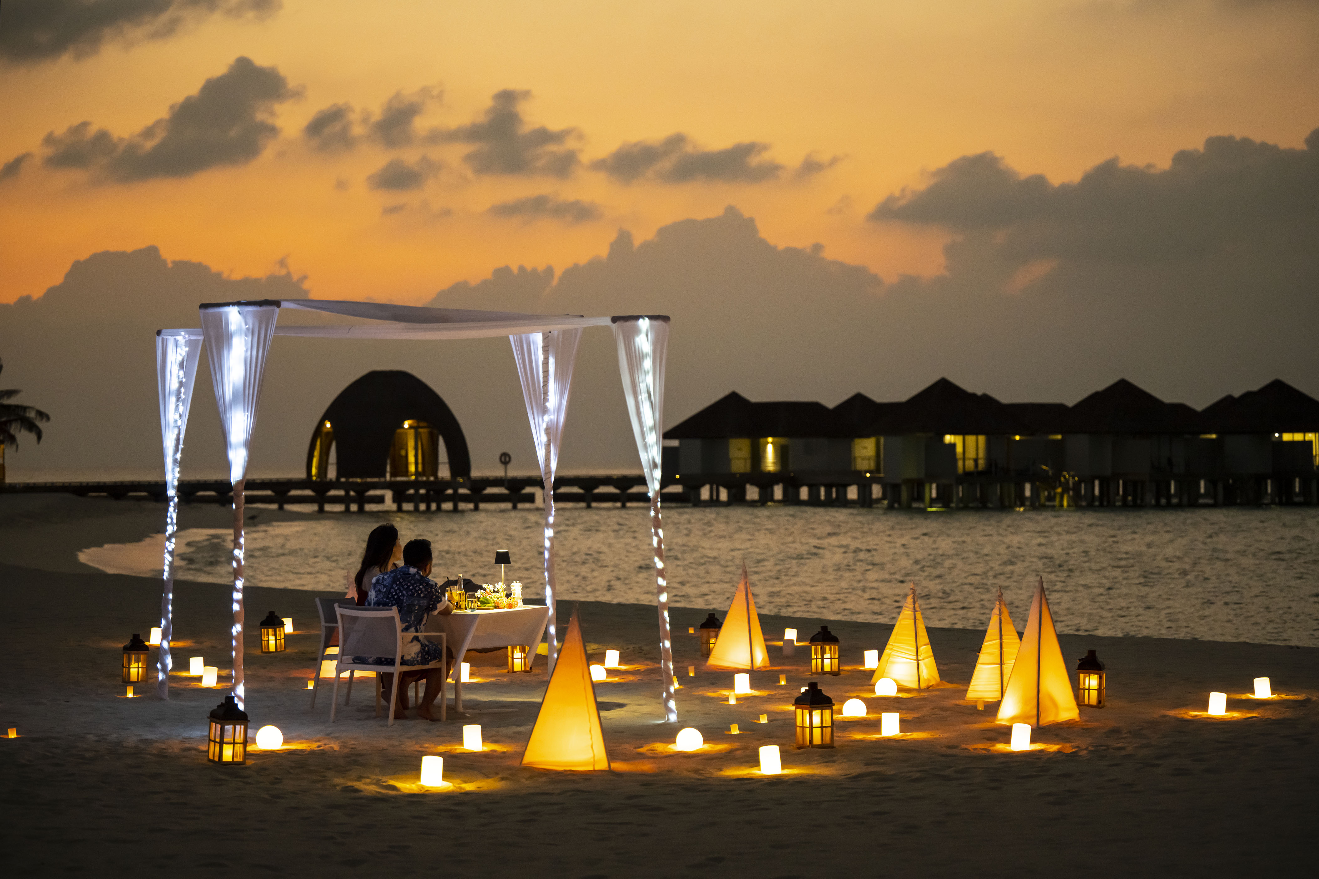 Candle dinner on the beach at OUTRIGGER Maldives Maafushivaru Resort